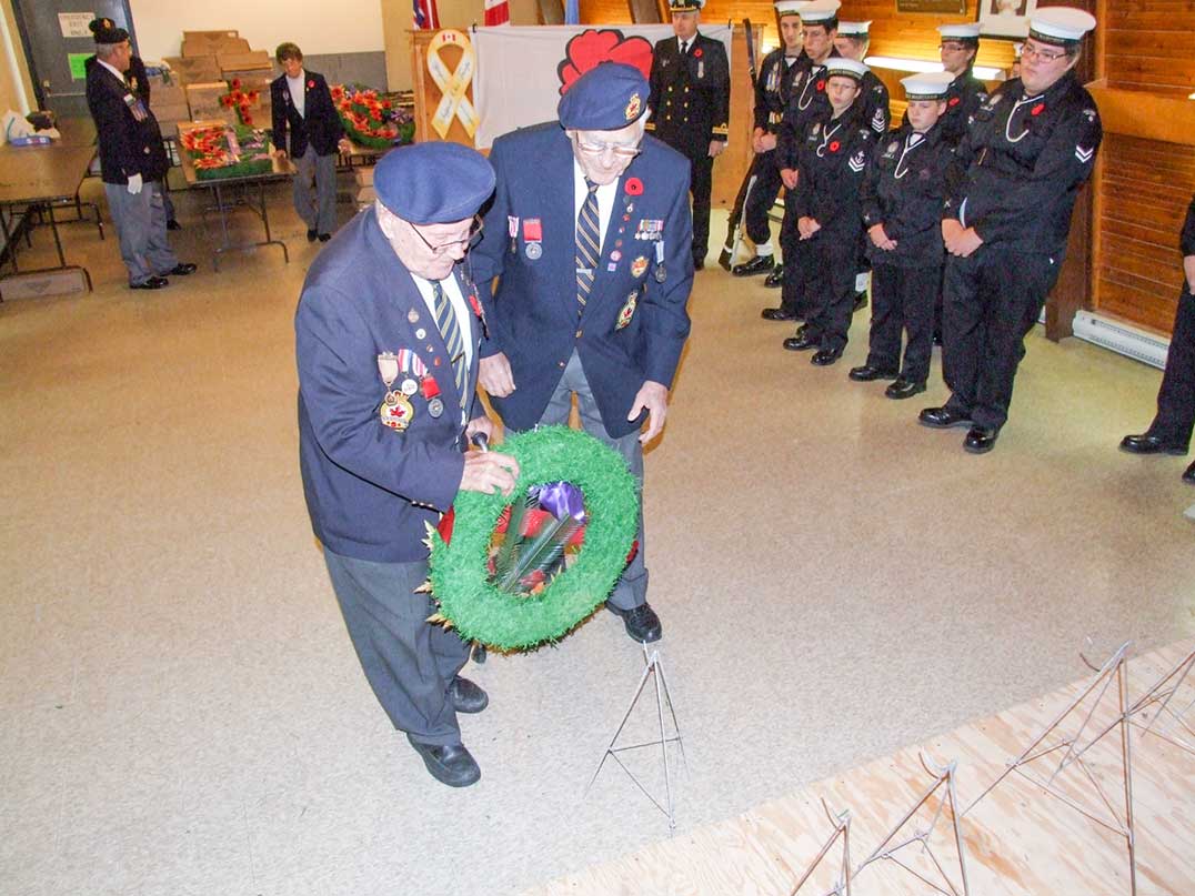 Humphrey Beaudin and Dennis Dockerell lay a wreath during a Remembrance Day ceremony at the Little Current Legion.