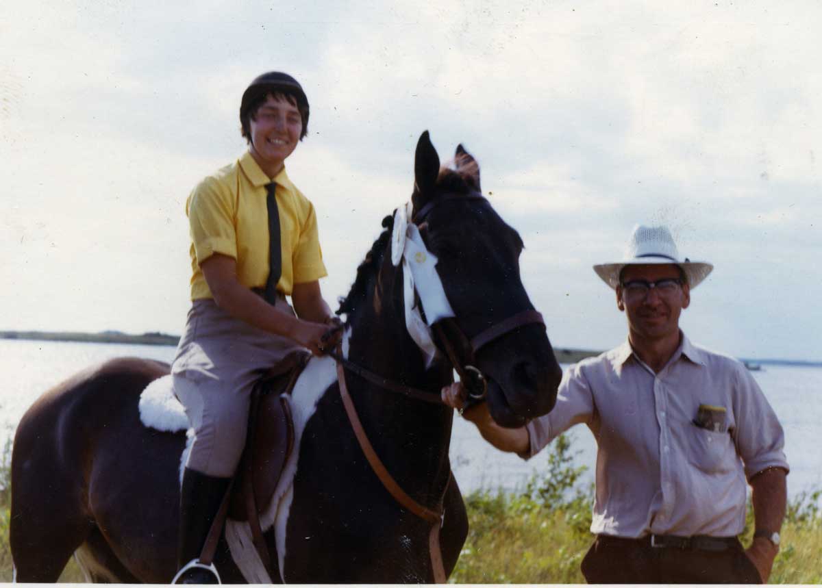 The new bride sits upon her horse held by husband John Buie. Mary Buie would often ride on horseback to visit John in the hospital where he was recovering from a bad snowmobile accident.