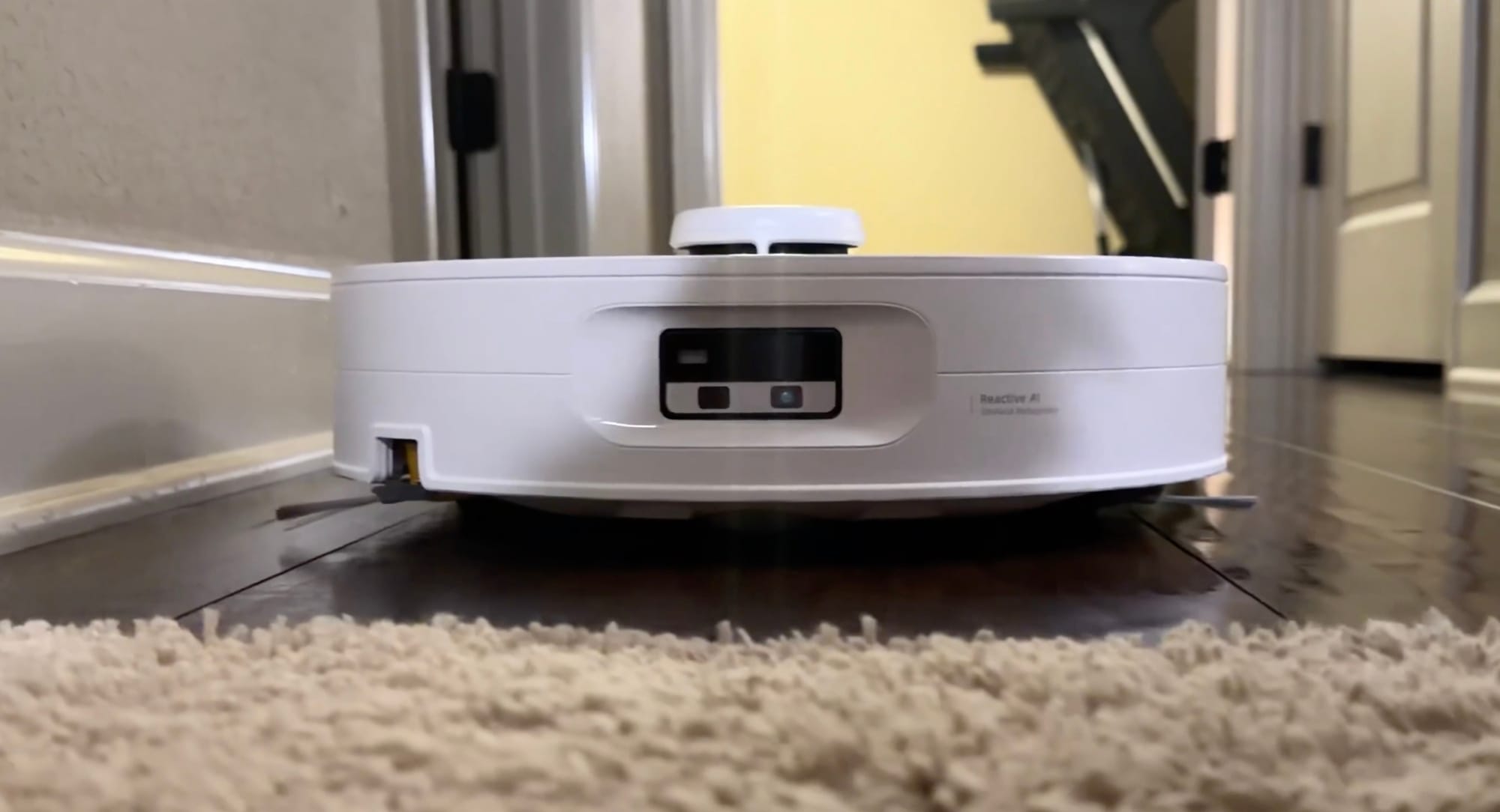 Curv 2 Flow robot vacuum navigating a hardwood floor.