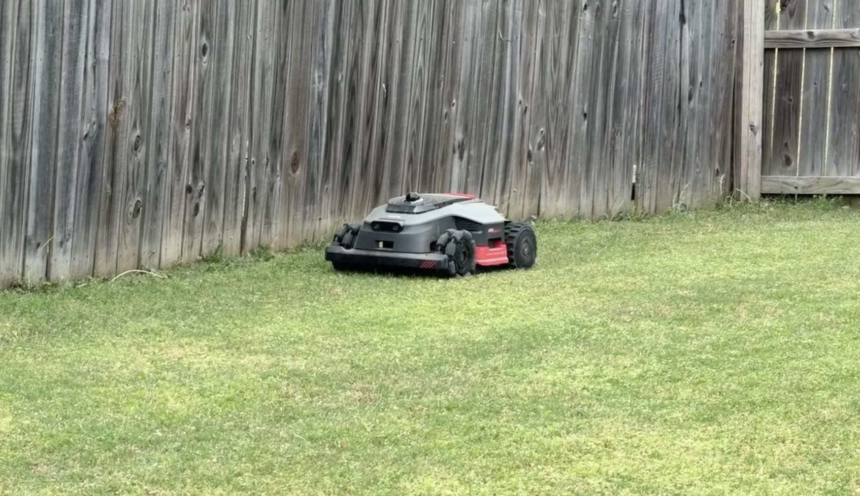 MOVA LiDAX 3000 AWD mowing along fence line