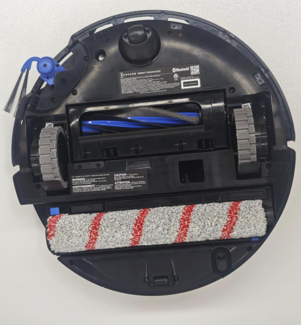 Underside of the Ecovacs X12S robot vacuum showing its main brush, extending side brush, drive wheels and track-style mop.