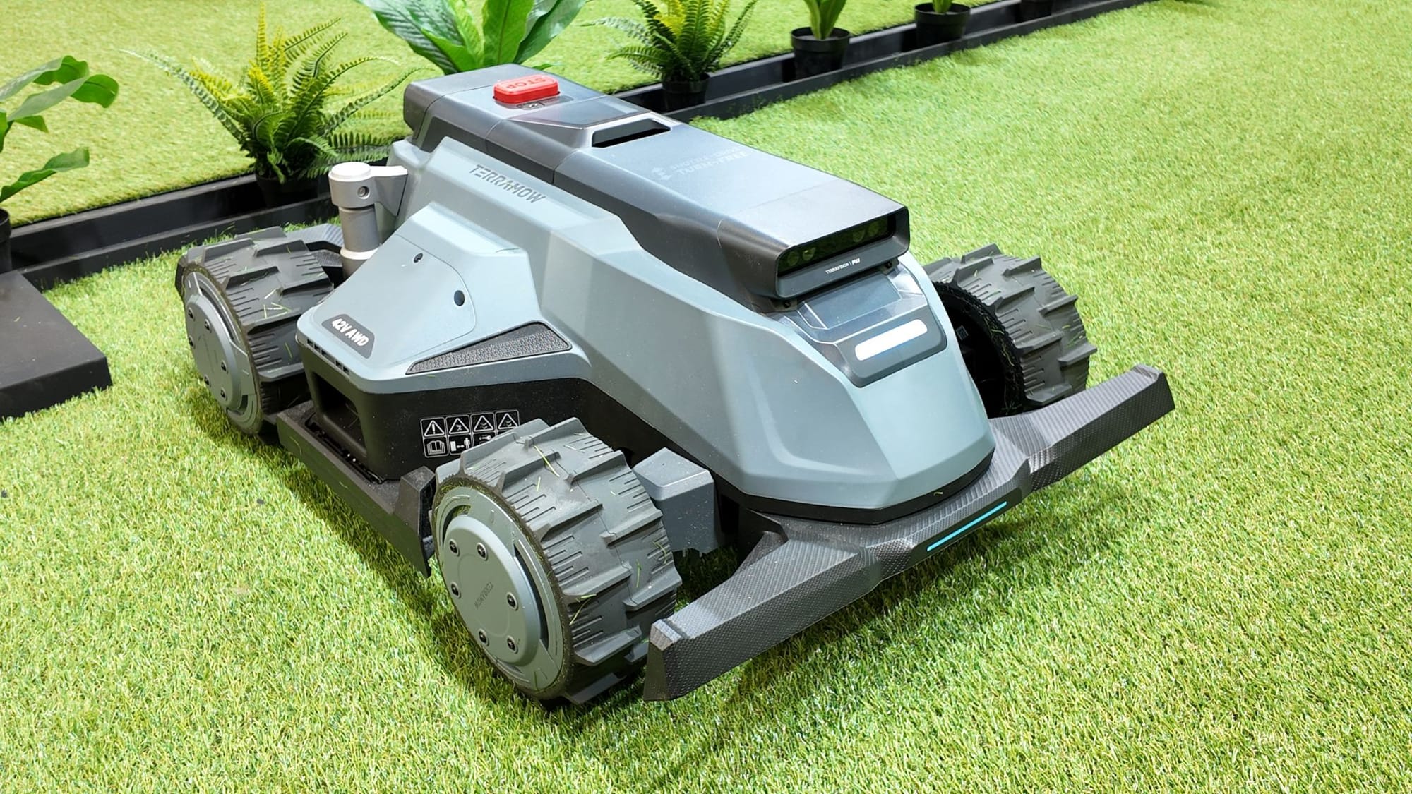 TerraMow X AWD robotic mower with four large drive wheels displayed on grass at GaLaBau 2026.