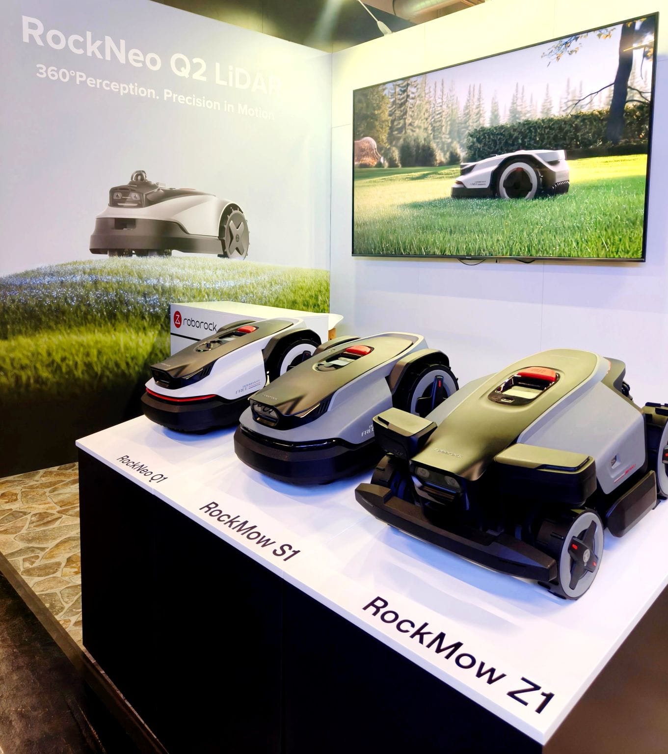 borock robotic mower lineup at GaLaBau 2026, including the RockNeo Q1, RockMow S1 and RockMow Z1, with RockNeo Q2 LiDAR branding in the background.