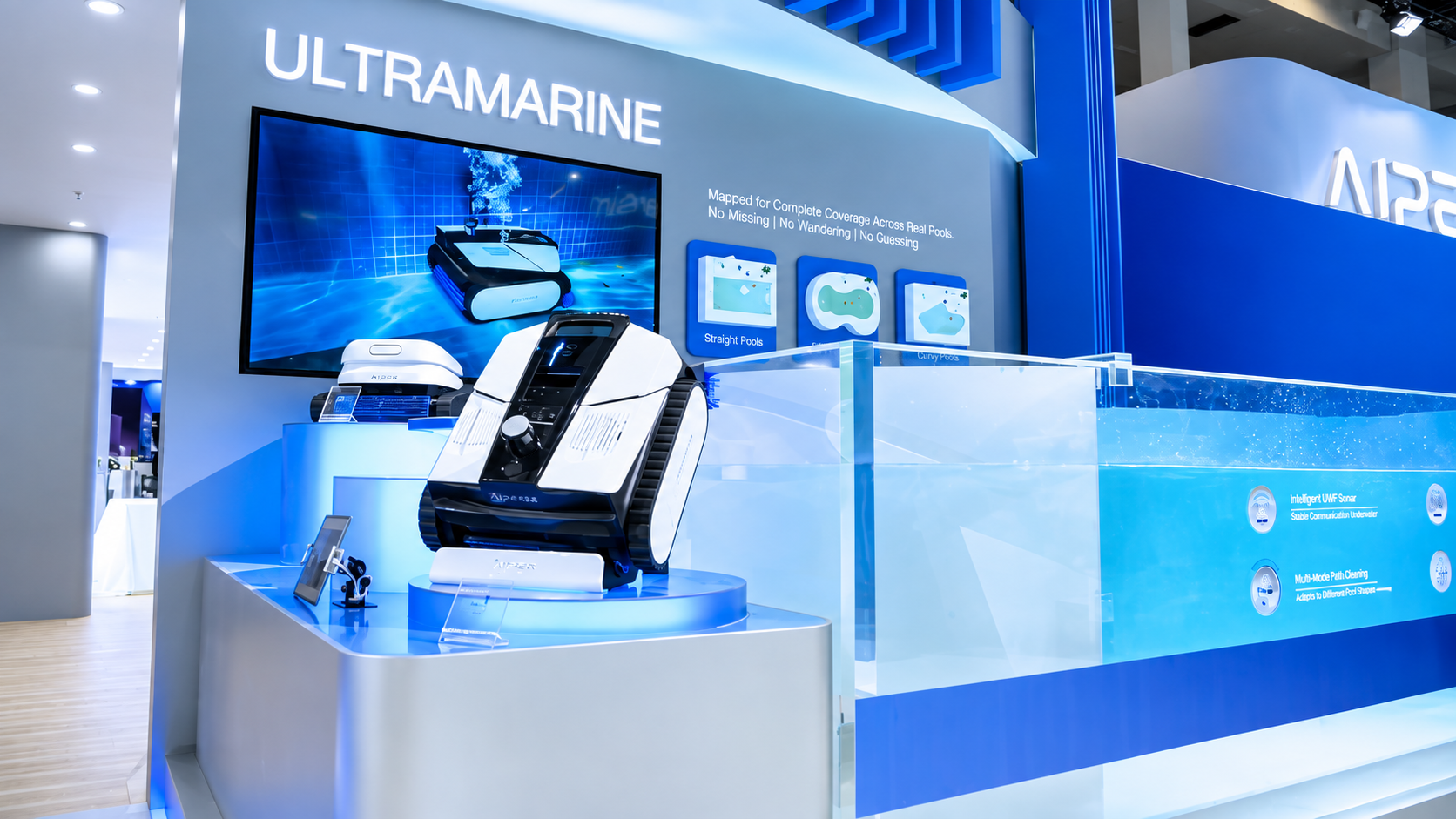 Ecovacs Ultramarine L1 robotic pool cleaner displayed at the company’s IFA 2026 booth beside a demonstration pool.