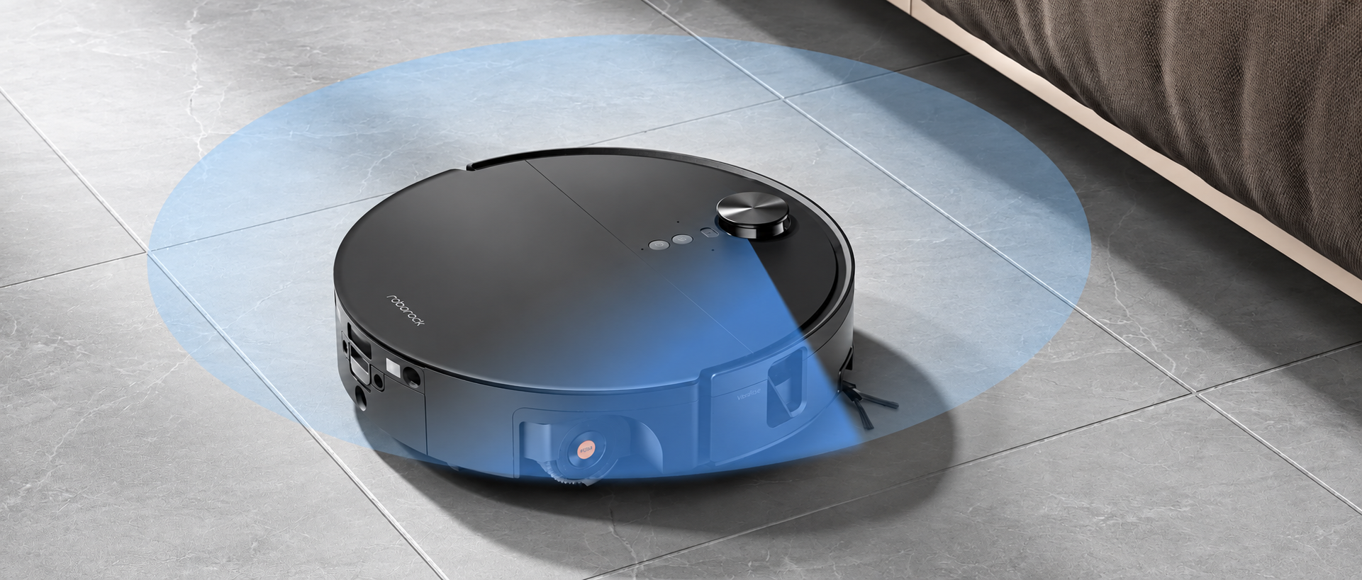 Roborock Saros 20 Flow robot vacuum showing its retractable lidar sensor while cleaning a hard floor.