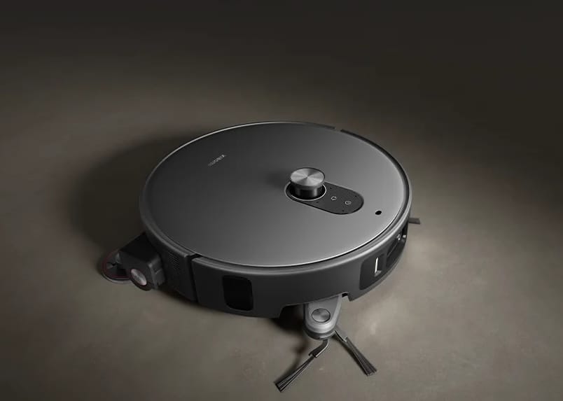 Dark gray Xiaomi Robot Vacuum 6 Max viewed from above, with its side brush and corner mop extended.