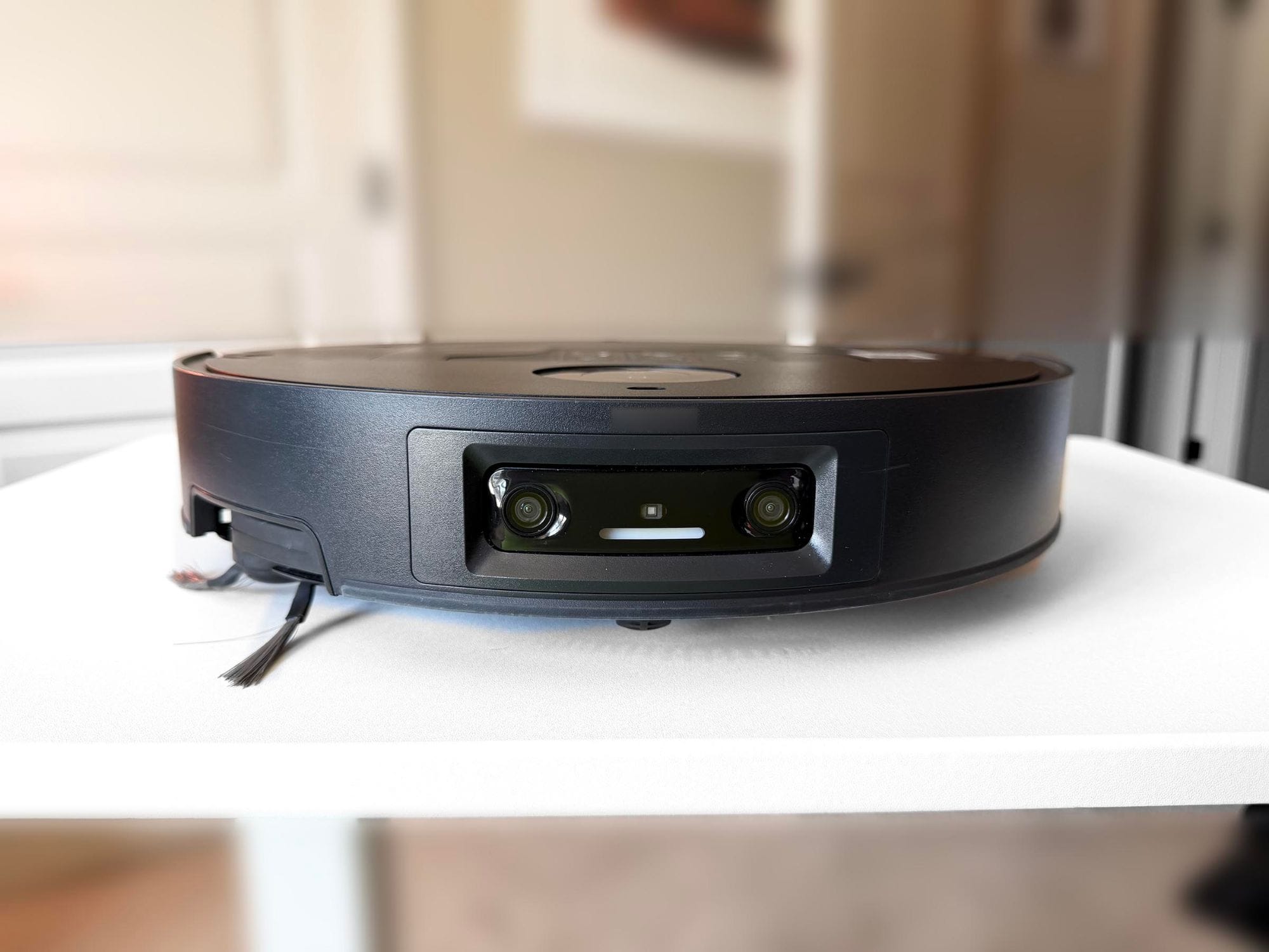 Front of the Dreame X60 Max Ultra Complete showing its two AI cameras and structured light sensor