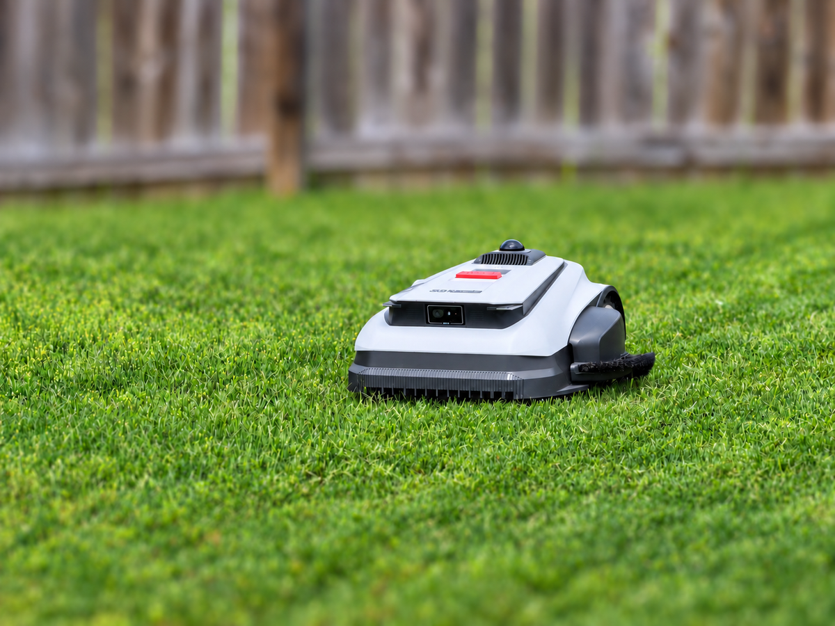 Front three-quarter view of the Ecovacs GOAT A2000 LiDAR Pro robotic mower on green grass.