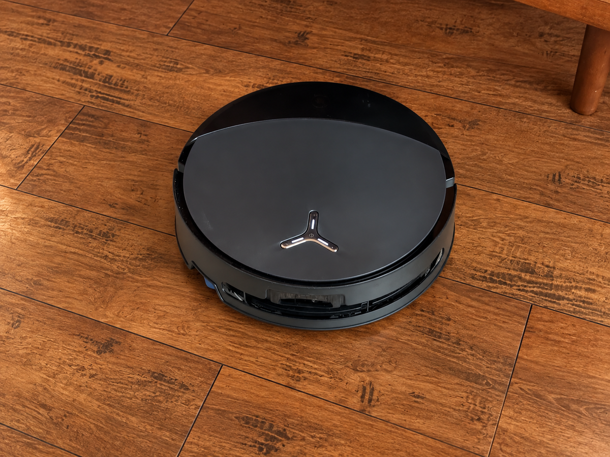 Ecovacs Deebot T90 Pro Omni robot vacuum and Omni station shown in a home.