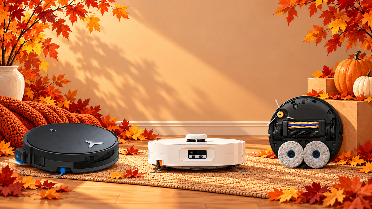 Fall-themed illustration showing three robot vacuums arranged among autumn leaves and pumpkins for Amazon Big Deal Days coverage.