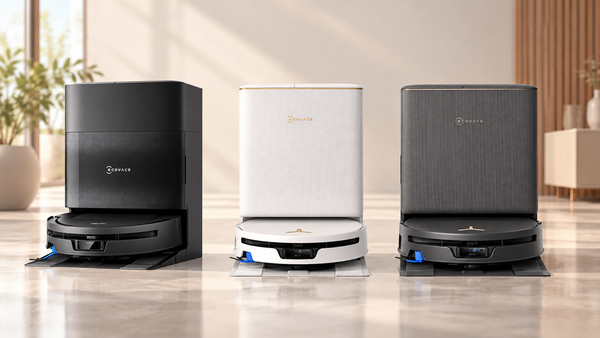Three Ecovacs T90-series robot vacuums with their docking stations, shown in black, white and dark gray.