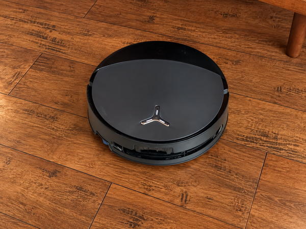 Ecovacs Deebot T90 Pro Omni robot vacuum and Omni station shown in a home.