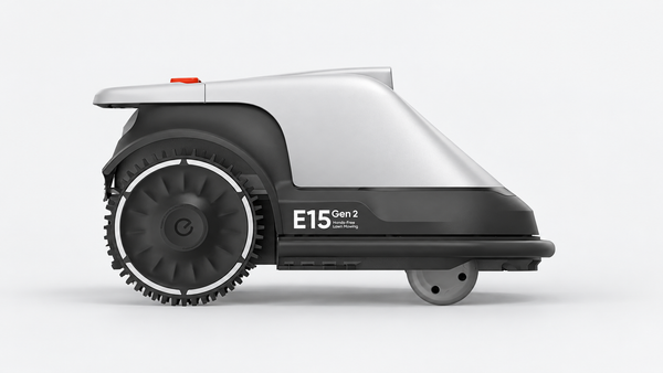 Side view of the silver and black Eufy E15 Gen 2 robotic lawn mower against a light gray background.
