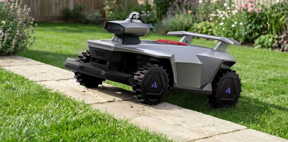 Anthbot R7 robotic lawn mower climbing over a raised stone path in a backyard.