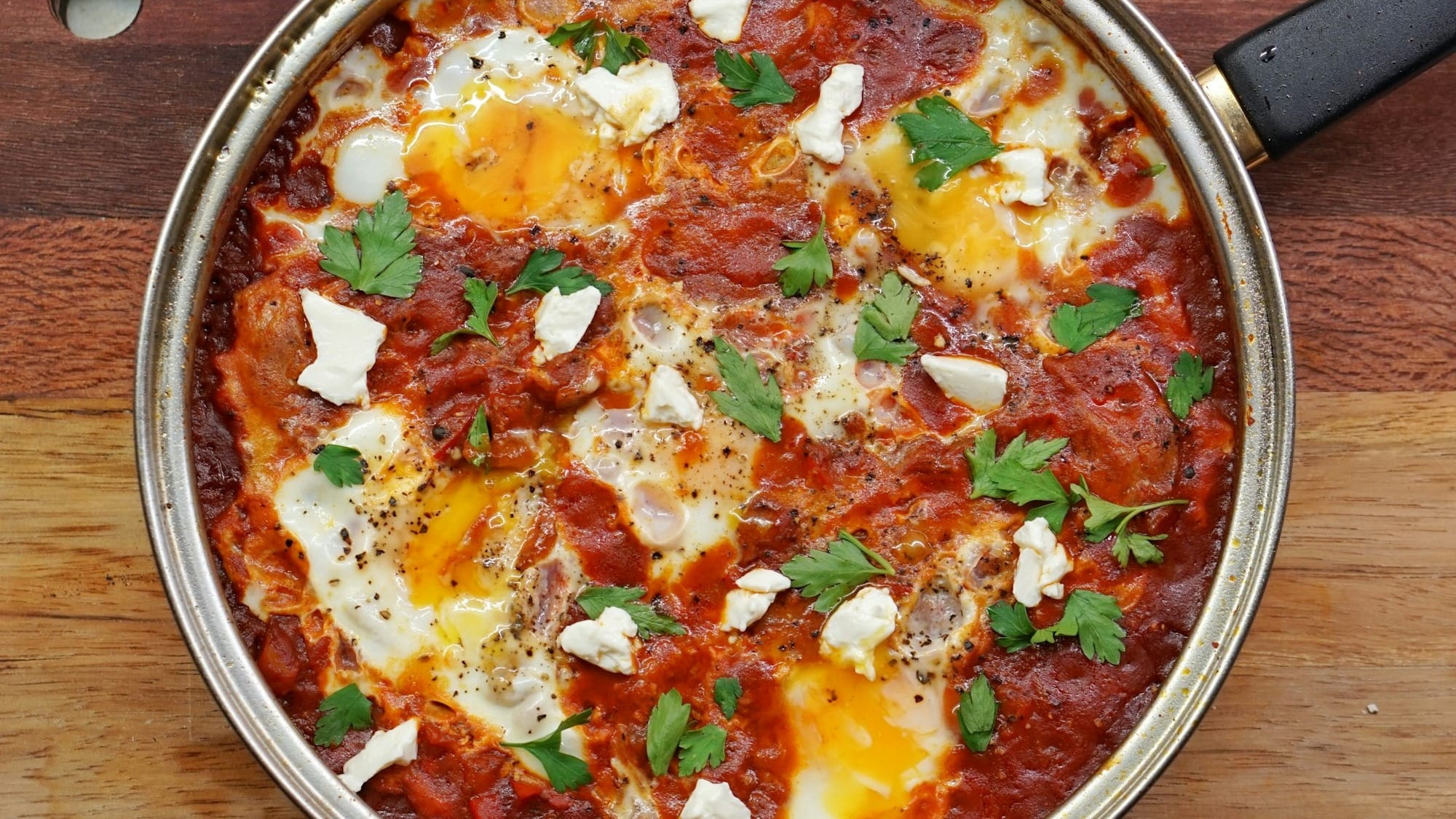 Stainless steel bowl of Shakshuka.