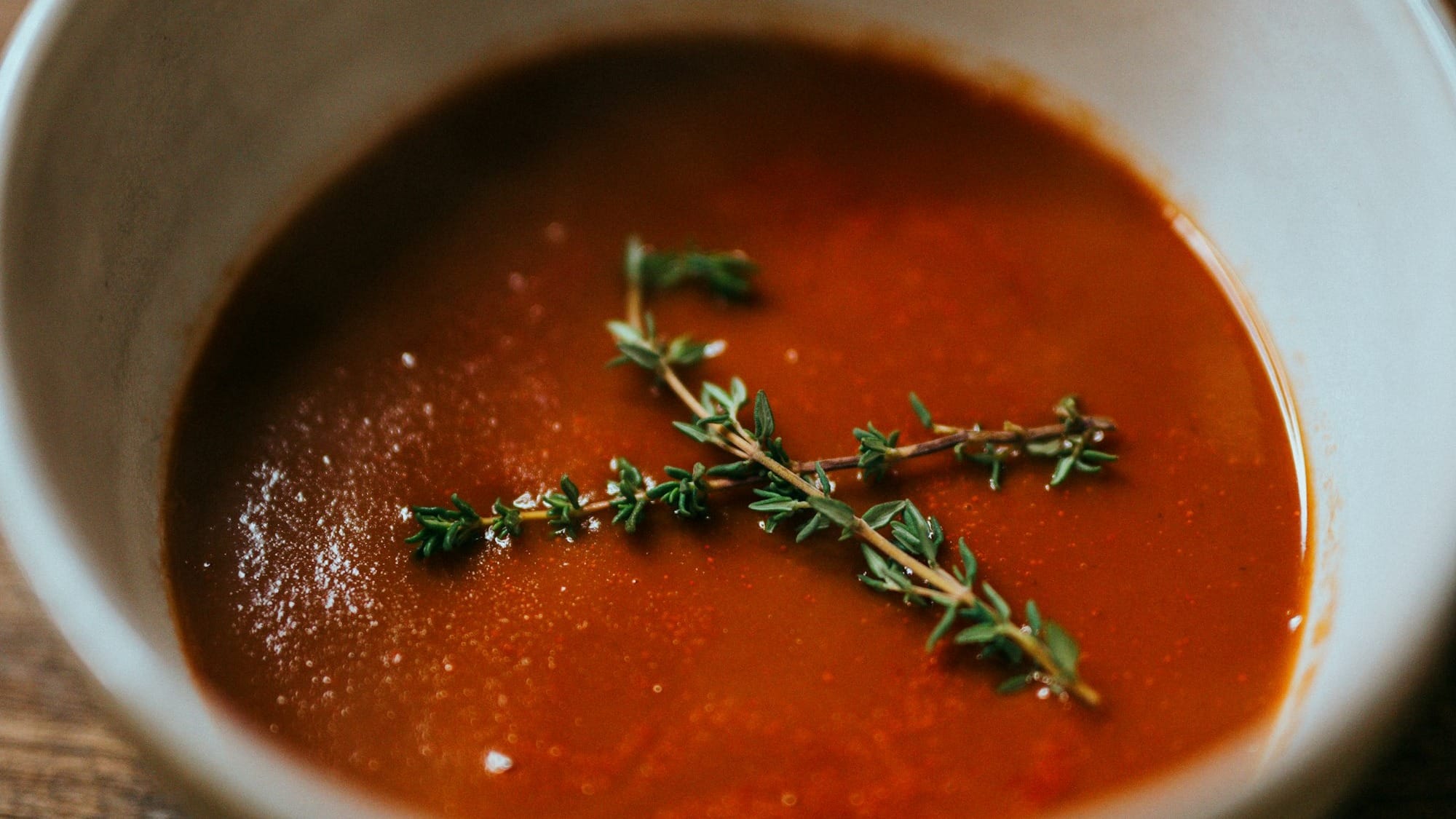 red soup in stainless steel bowl