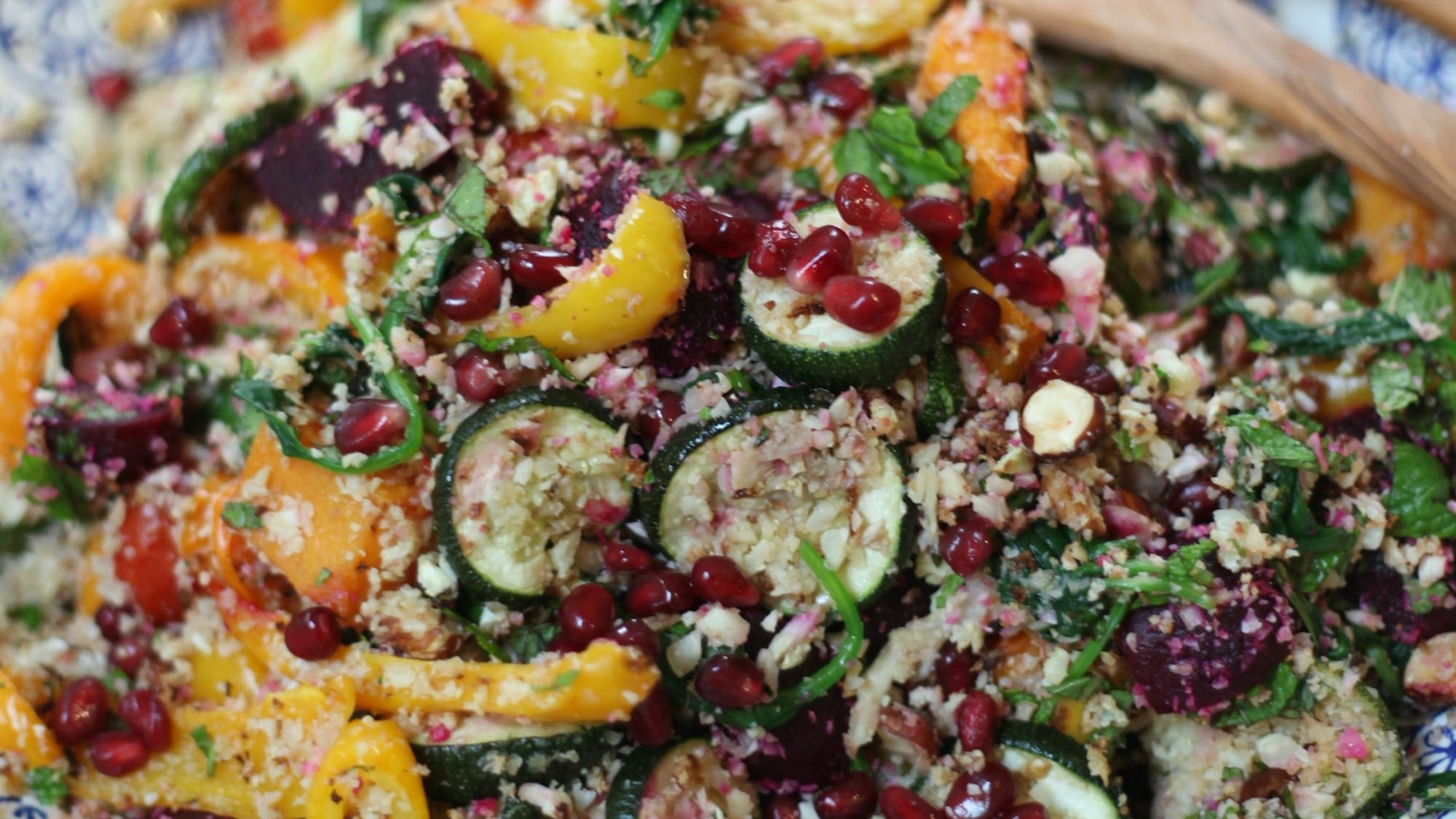 Vegetable couscous on a ceramic plate.