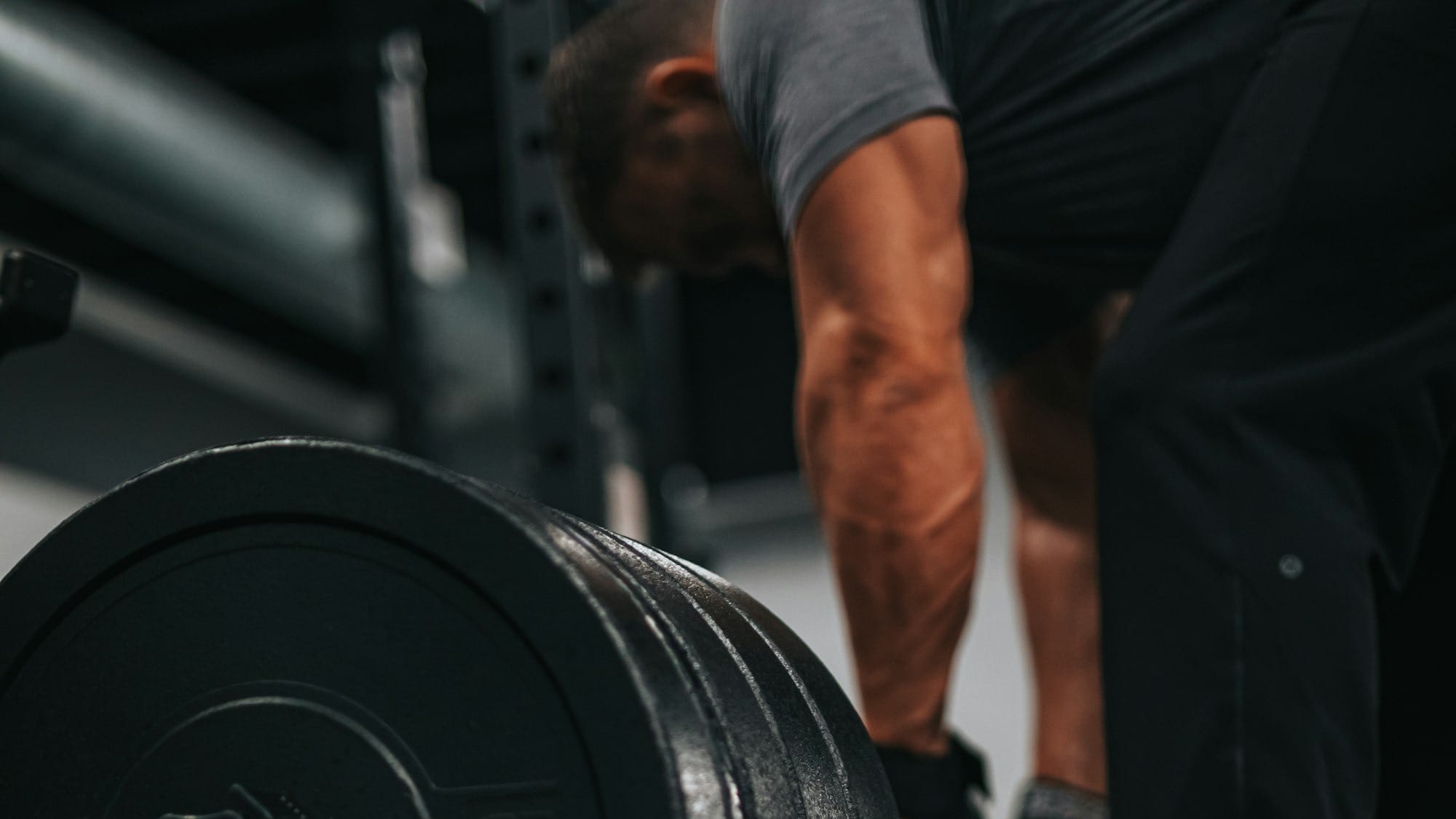 Man in the gym preparing for a deadlift.