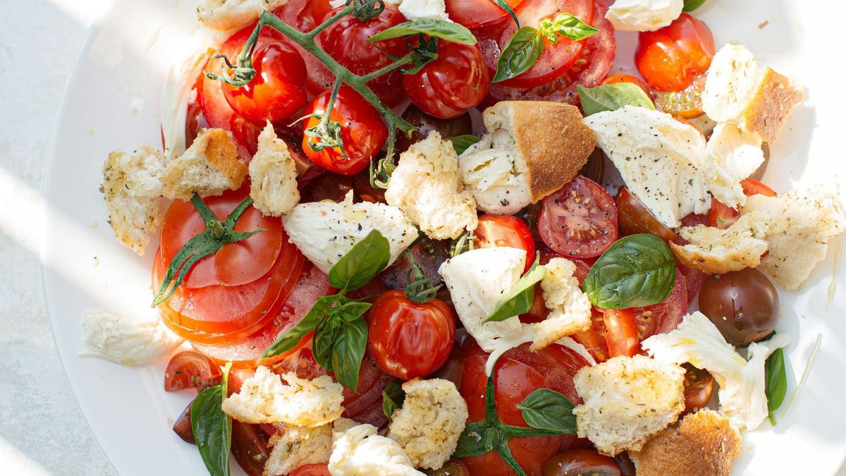 Greek salad with tomatoes on a plate.