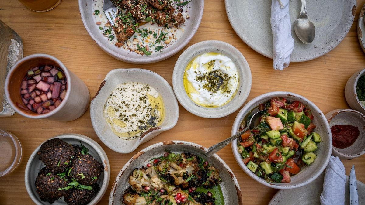Table full of Mediterranean dishes.