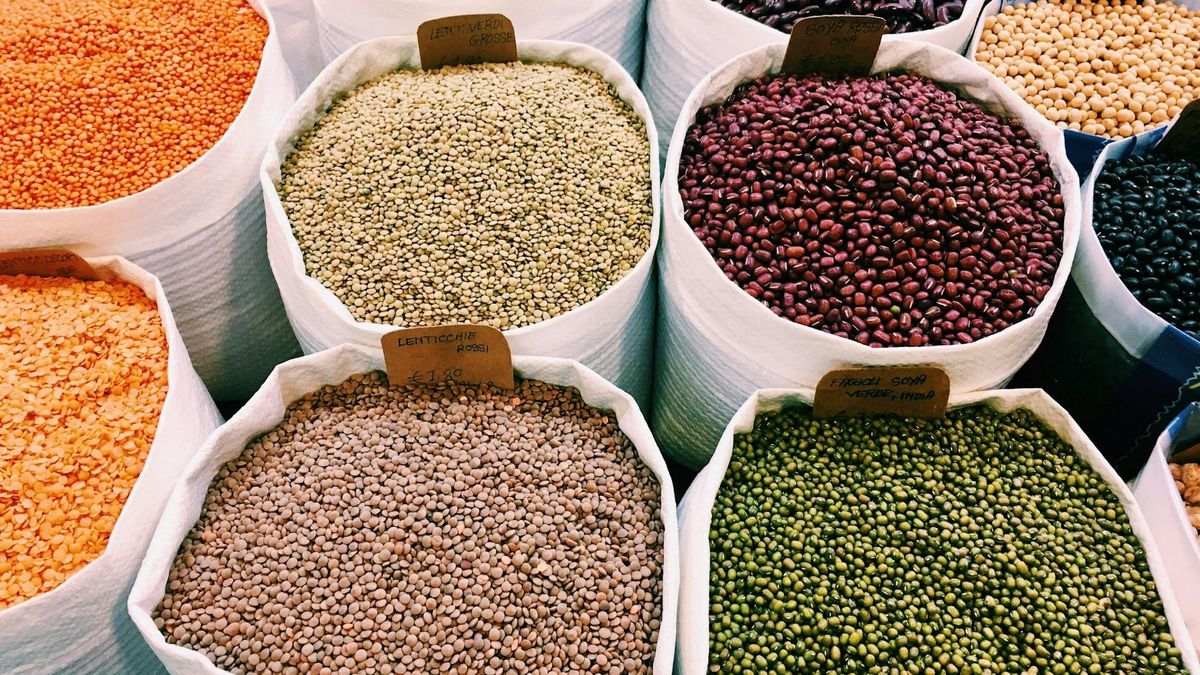 Bags of legumes in a market.