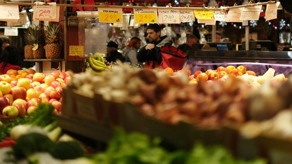Food market with stall full of vegetables