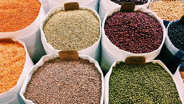 Bags of legumes in a market.