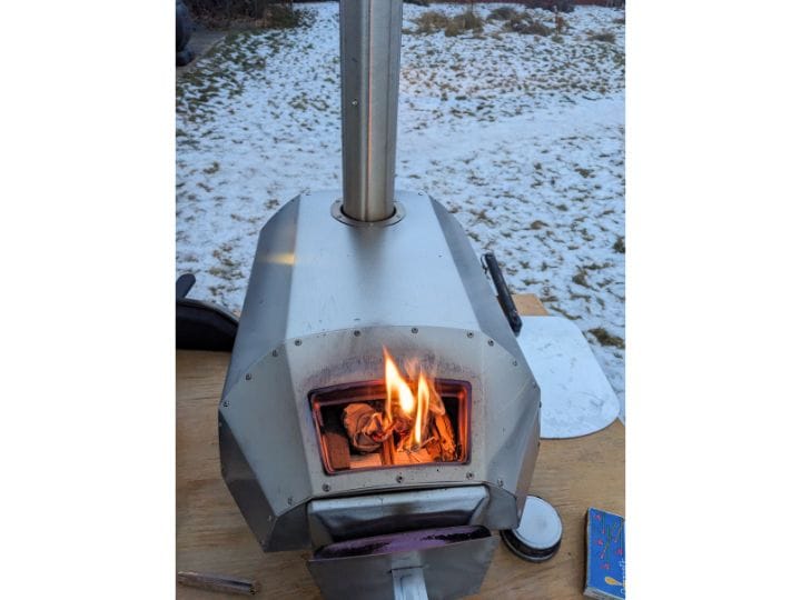 Fire starting in the back of the pizza oven.