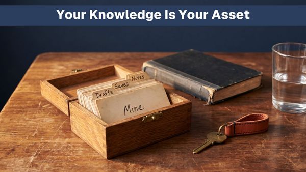 A wooden card-file box of handwritten index cards tabbed Notes, Saves, Drafts and Mine, with a brass key beside it on a worn desk