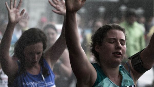runners in the London Marathon, 2015 - raising their arms in relief