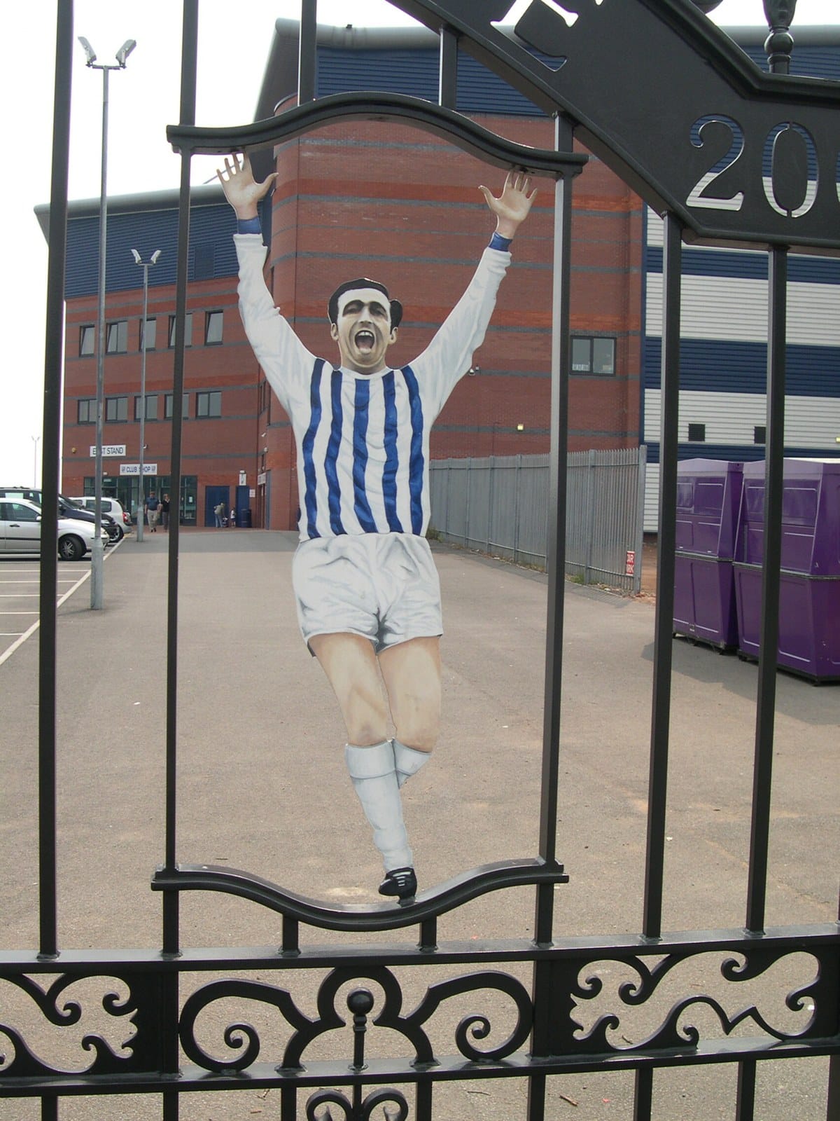 The Jeff Astle Gates at The Hawthorns — West Bromwich Albion, named for a neighborhood, not the poem (public domain)