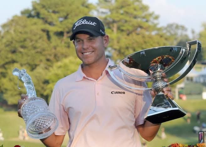 Bill Haas with both trophies — the Tour Championship and the FedEx Cup, 2011