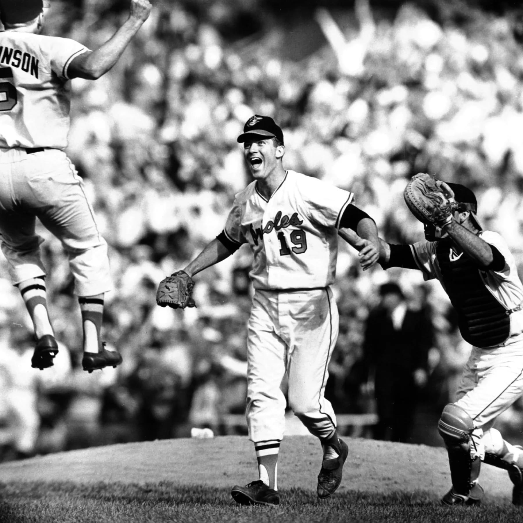 Oct. 9, 1966: Dave McNally (19) after the final out of the World Series sweep at Memorial Stadium. Twelve years after leaving St. Louis, the franchise was a champion.