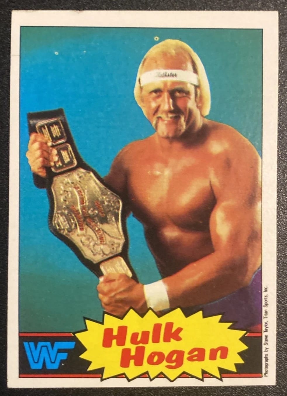 1985 Topps WWF Pro Wrestling Stars No. 1, Hulk Hogan: blue background, yellow starburst, the WWF block logo.
