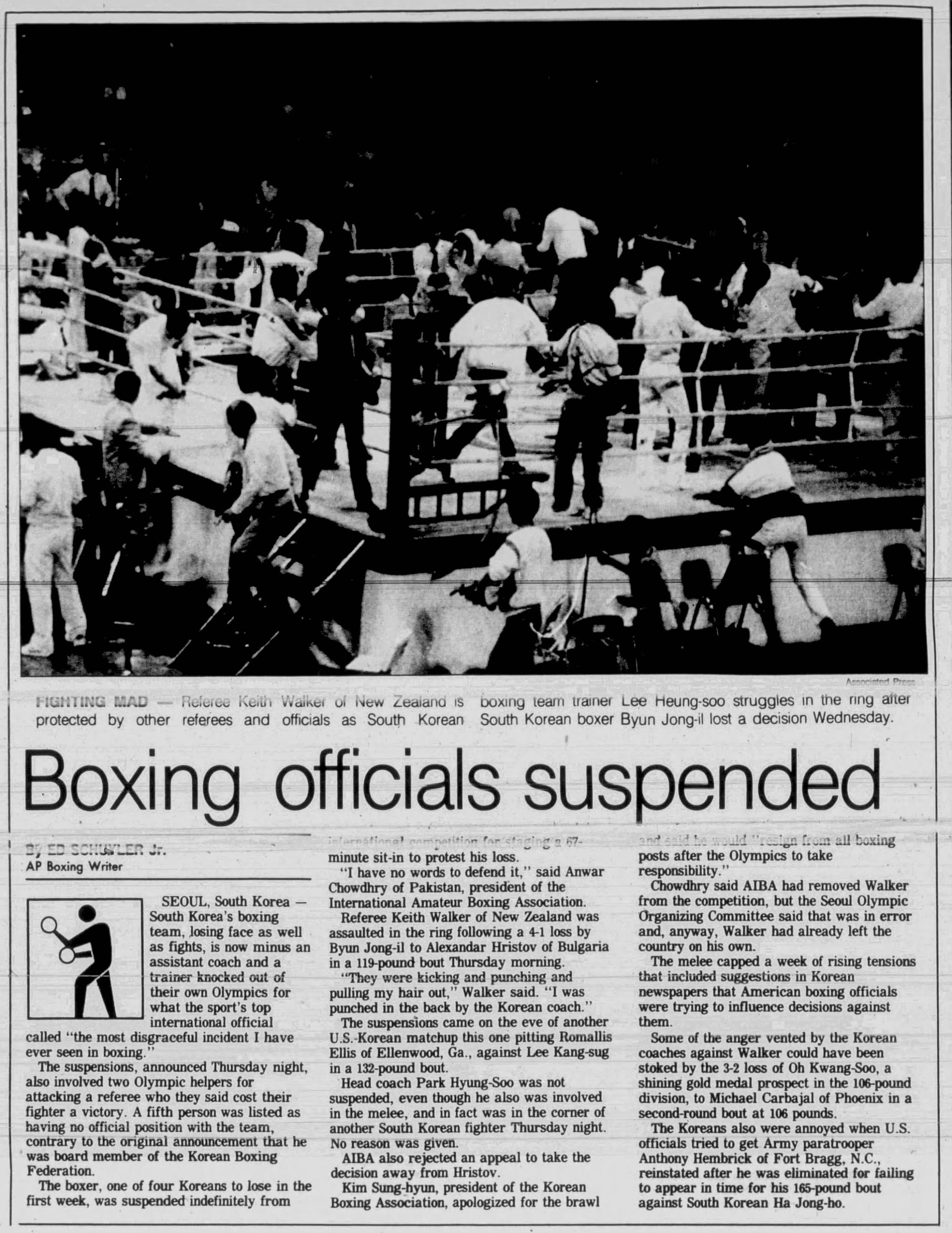 The Press-Enterprise, Sept. 23, 1988. Referee Keith Walker is shielded by other officials as the Korean corner comes into the ring.