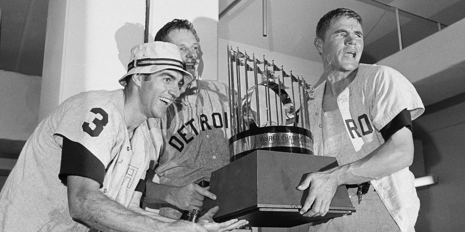 Dick McAuliffe, Jim Northrup and Mickey Stanley with the trophy in the visitors' clubhouse at Busch Stadium.