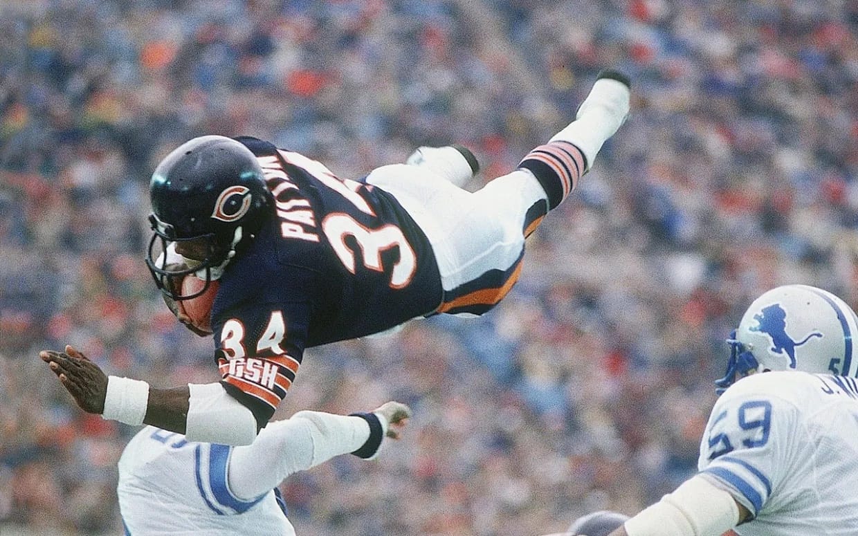 Payton, airborne over Detroit. He carried the ball more times than anyone in the history of the sport.