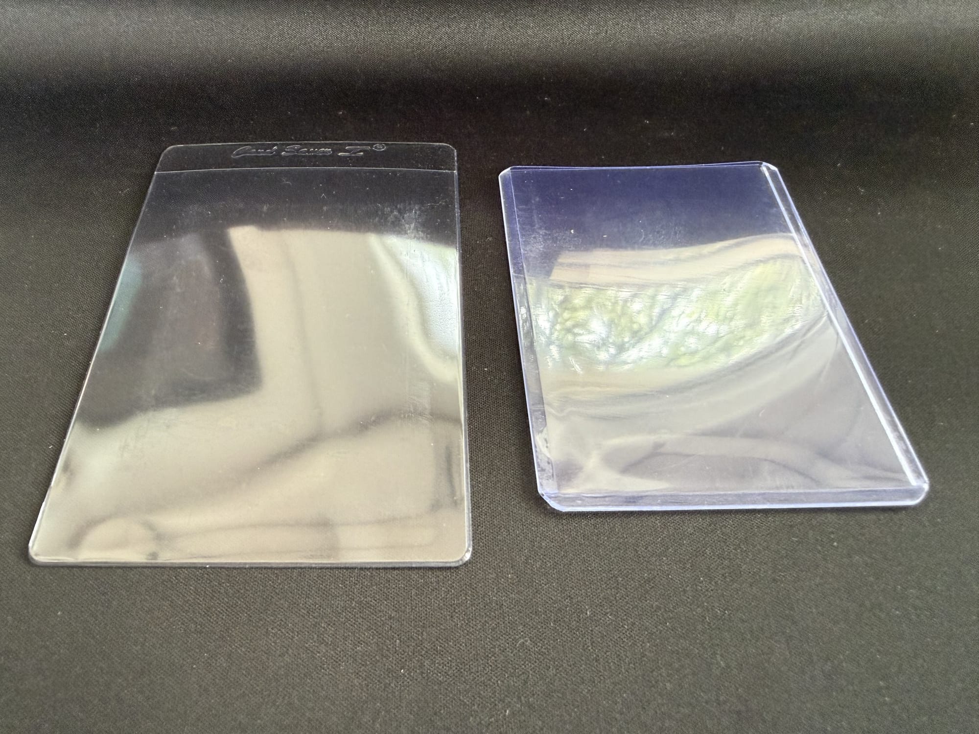 A Card Saver 1 on the left, a 3x4 top loader on the right. Same job, different plastics.