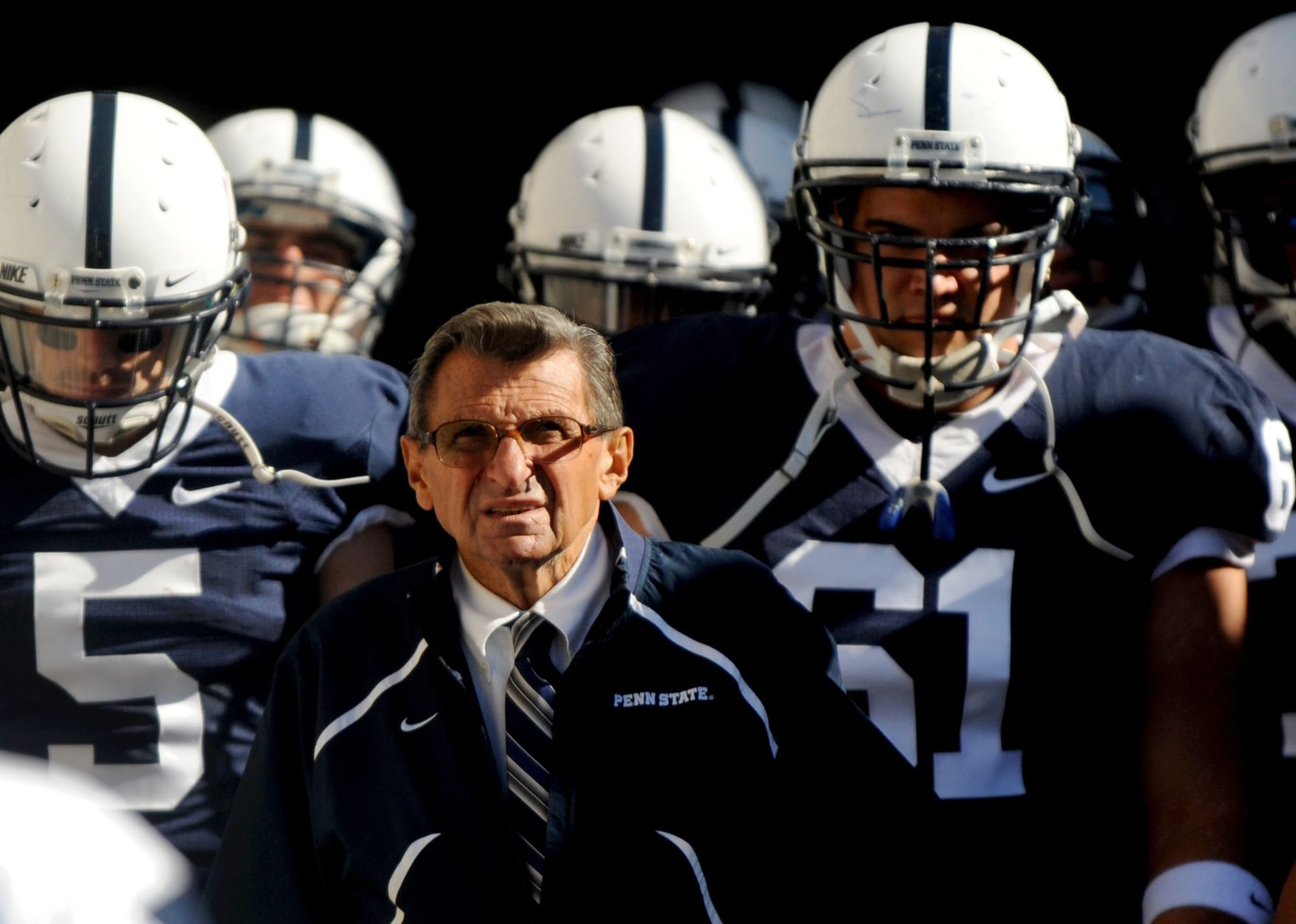 Paterno among his players — 46 seasons, and no exit plan.