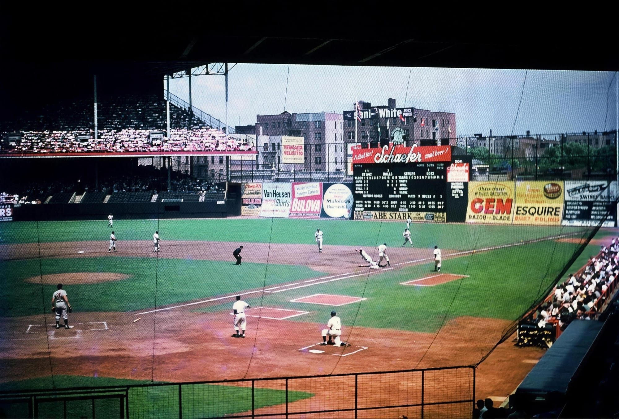The view from the upper deck: Schaefer, Bulova, GEM and Esquire on the wall, and the Abe Stark sign nobody could hit.