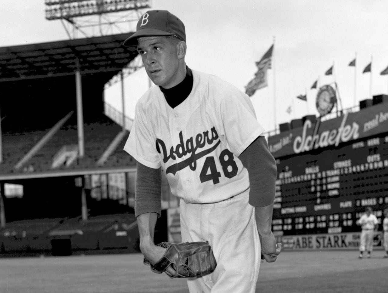 Karl Spooner at Ebbets Field, No. 48, with the Schaefer scoreboard behind him.