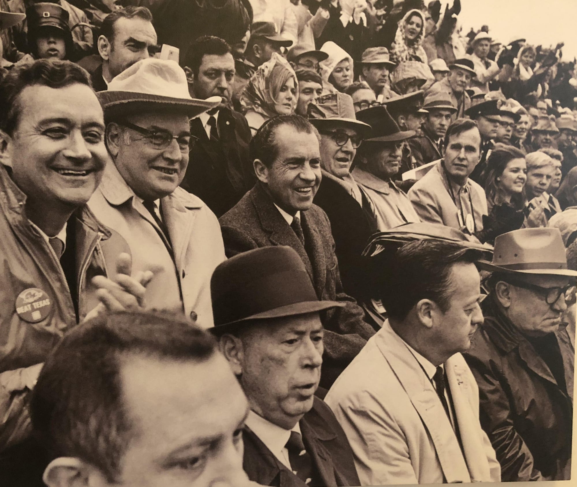 President Nixon (center) in the stands at Fayetteville.