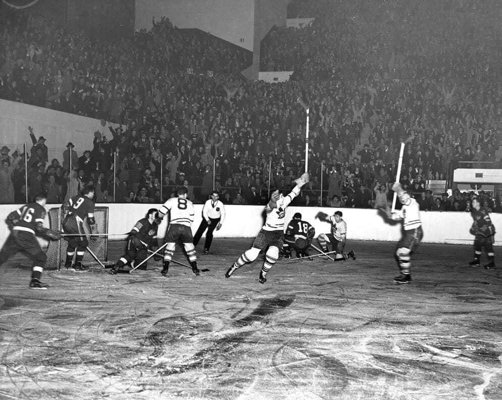 Original Six hockey: a packed house and a goal celebration.