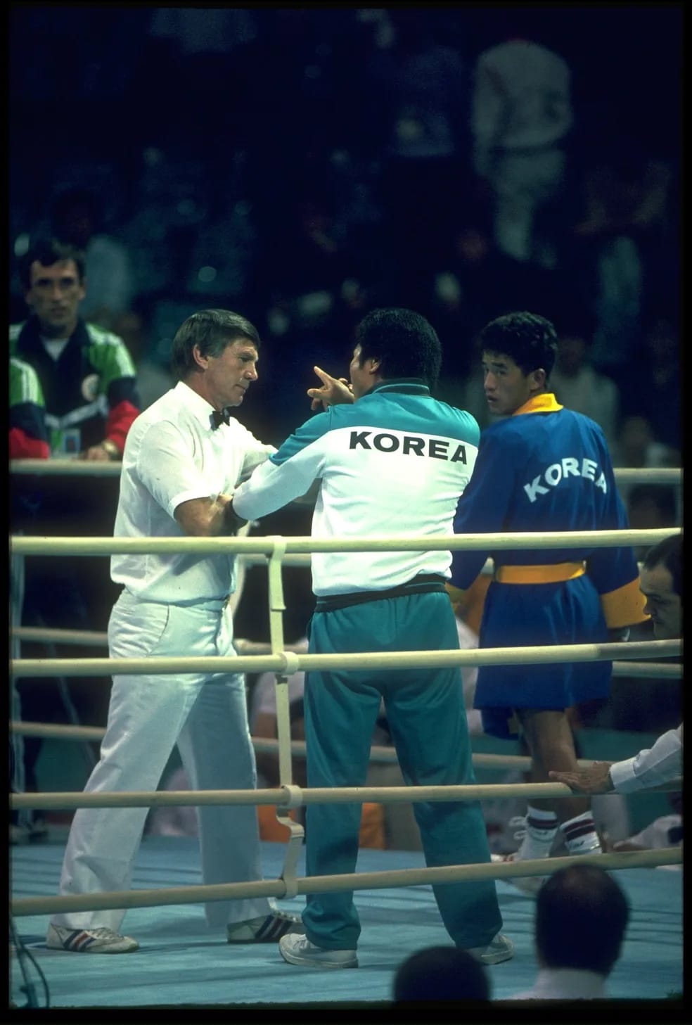 Referee Keith Walker being confronted by the Korean corner.