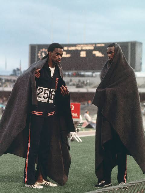 Boston, in bib 256, wrapped against the weather between jumps.