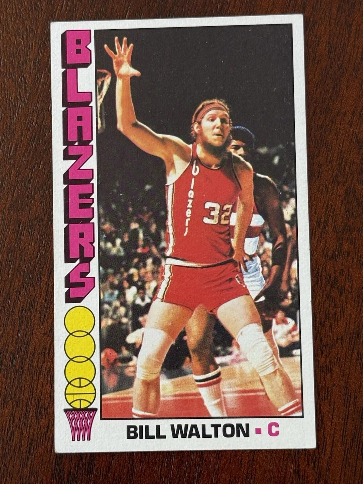 The famous oversized 1976-77 Topps Bill Walton — Portland road reds, photographed in Washington's building.