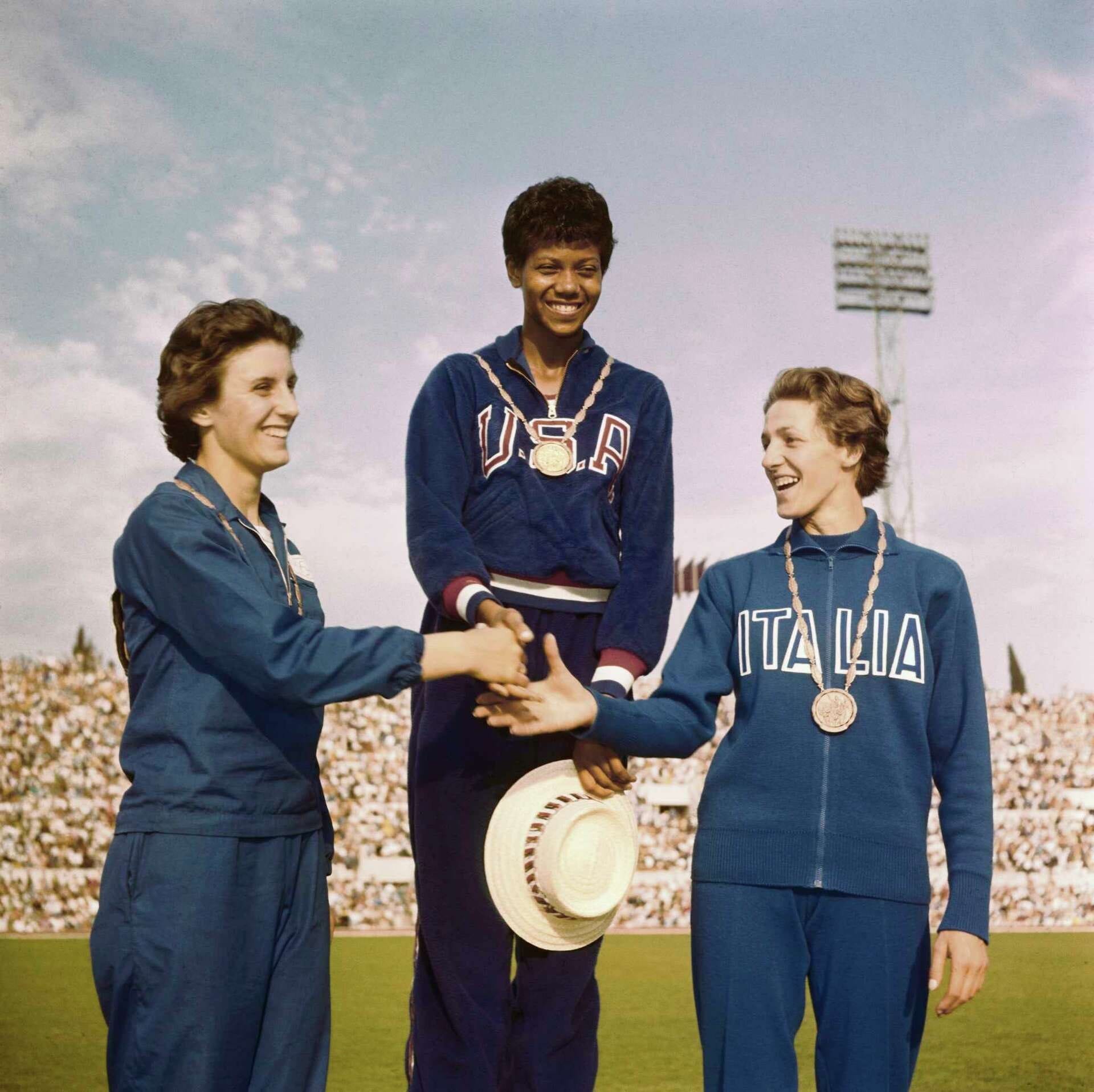 The 100m podium: Rudolph gold, with Dorothy Hyman of Great Britain and Italy's Giuseppina Leone.
