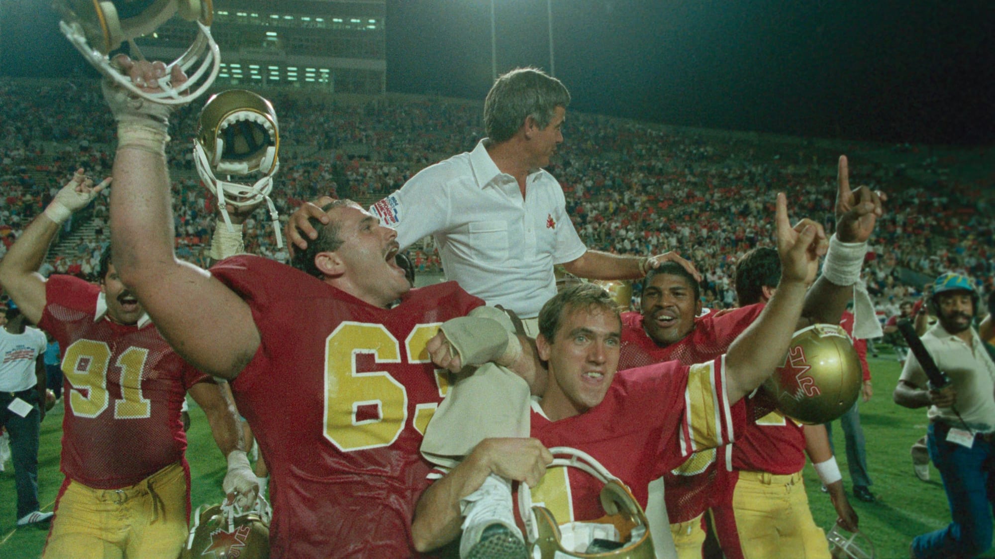 The Philadelphia Stars carry Jim Mora after the 1984 title. A year later, as the Baltimore Stars, they'd win the last USFL game ever played.