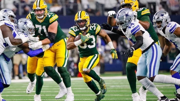 Aaron Jones and the Packers run through Dallas, January 14, 2024.
