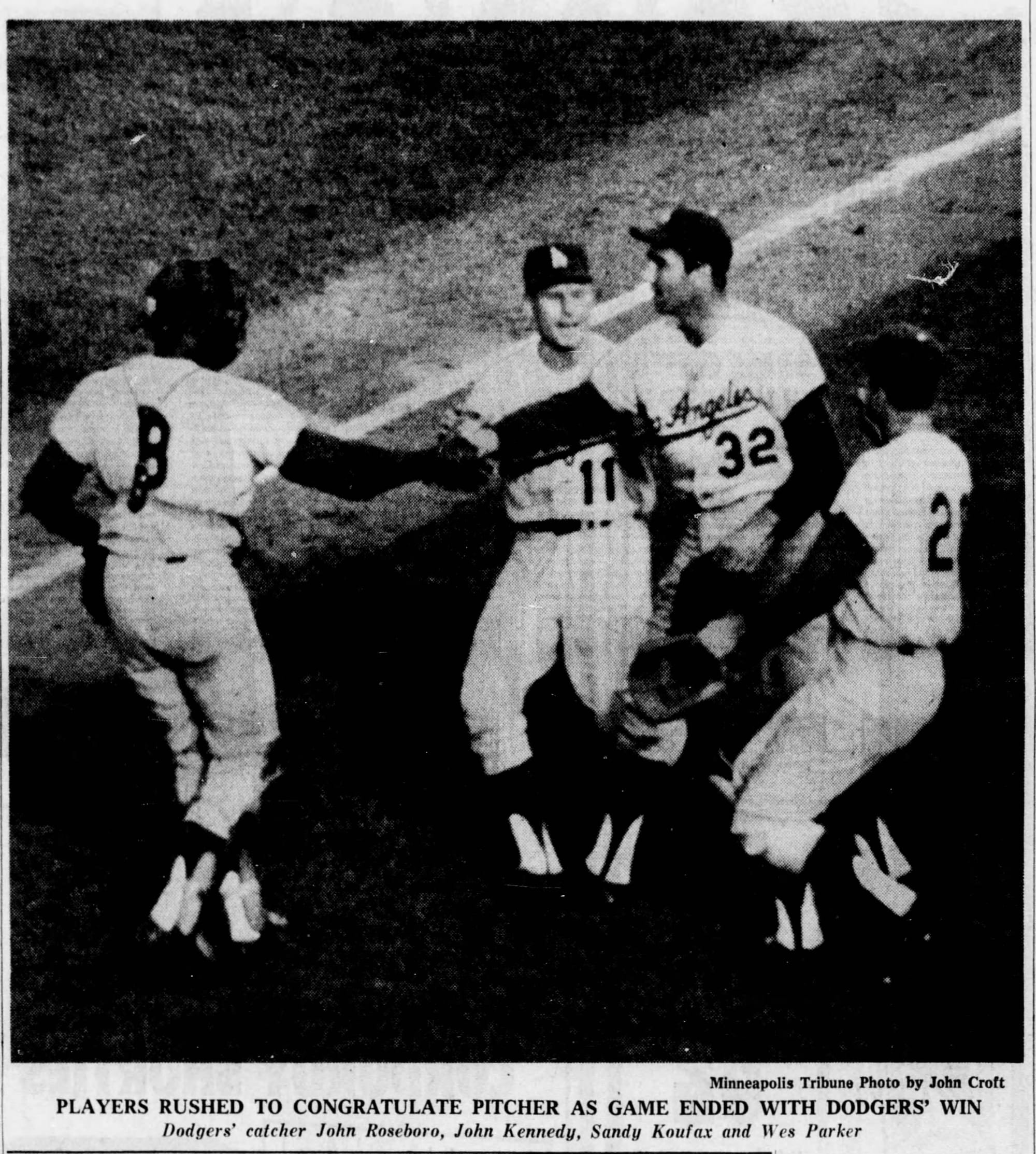 "Players rushed to congratulate pitcher as game ended with Dodgers' win." John Roseboro, John Kennedy, Sandy Koufax and Wes Parker. (Minneapolis Tribune photo by John Croft)